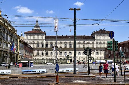 Turin, Piedmont, Italy. June 2019. View of the royal palace from via Pietro Micca: the palace acts as a majestic backdrop to the square. Blue summer sky with white clouds.のeditorial素材