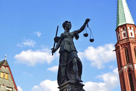 Frankfurt am Main, Germany, August 2019. The RÃ¶merberg square is characterized by the fountain of justice. The statue holds the symbolic plates of the scale, moved lightly by the wind like clouds.のeditorial素材