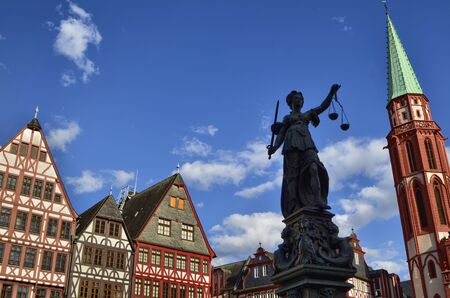 Frankfurt am Main, Germany, August 2019. The RÃ¶merberg square is characterized by the fountain of justice. The statue holds the symbolic plates of the scale, moved lightly by the wind like clouds.のeditorial素材