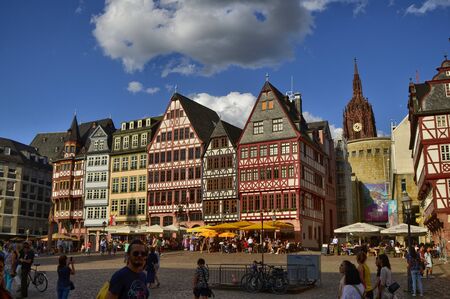 Frankfurt am Main, Germany, August 2019. The RÃ¶merberg is the historic square with fascinating historic buildings and the church. Crowded with tourists. The bell tower of the cathedral can be seen.のeditorial素材
