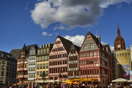 Frankfurt am Main, Germany, August 2019. The RÃ¶merberg is the historic square with fascinating historic buildings and the church. Crowded with tourists. The bell tower of the cathedral can be seen.のeditorial素材