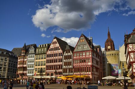 Frankfurt am Main, Germany, August 2019. The RÃ¶merberg is the historic square with fascinating historic buildings and the church. Crowded with tourists. The bell tower of the cathedral can be seen.のeditorial素材