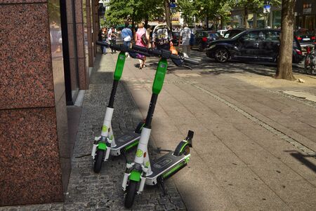 Frankfurt am Main, Germany. August 2019. Electric scooters for hire. They are found parked around the city, colored in white and green.のeditorial素材