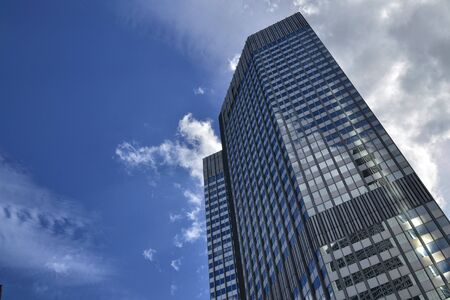 Frankfurt am Main, Germany. August 2019. Modern skyscrapers. They have mirrored facades that reflect...