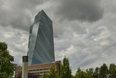 Frankfurt am Main, Germany, August 2019. The new headquarters of the ECB is a skyscraper with a very modern design: steel glass gives a mirrored facade that reflects the sky and the surrounding cloudsのeditorial素材