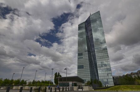 Frankfurt am Main, Germany, August 2019. The new headquarters of the ECB is a skyscraper with a very modern design: steel glass gives a mirrored facade that reflects the sky and the surrounding cloudsのeditorial素材