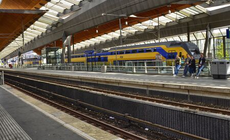 Amsterdam, Holland, August 2019. Inside the metro station bijlmer arena, view on the quay. Modern structure with steel and wood glass.のeditorial素材