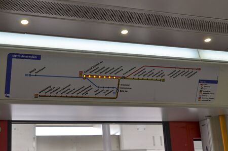 Amsterdam, Holland, August 2019. Inside the metro train the map with the luminous LEDs of the city's metro network. The station that is reached lights up.のeditorial素材