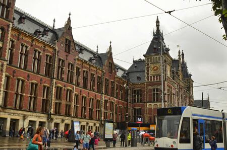 Amsterdam, Holland, August 2019. Leaving the central train station we can appreciate the red brick architecture.のeditorial素材