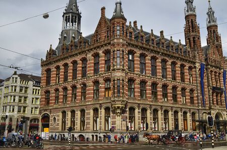Amsterdam, Holland. August 2019. Behind Piazza Dam, Il Magna Plaza: the luxury shopping center in the historic center. The beauty of the red brick building strikes tourists.のeditorial素材
