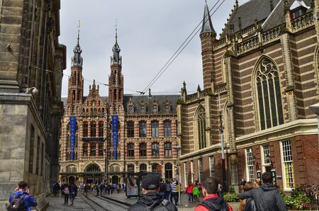 Amsterdam, Holland. August 2019. Behind Piazza Dam, Il Magna Plaza: the luxury shopping center in the historic center. The beauty of the red brick building strikes tourists.のeditorial素材