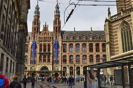 Amsterdam, Holland. August 2019. Behind Piazza Dam, Il Magna Plaza: the luxury shopping center in the historic center. The beauty of the red brick building strikes tourists.のeditorial素材