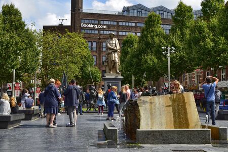 Amsterdam, Holland, August 2019. In the square that houses the Rembrandt Monument, people flock to take a souvenir photoのeditorial素材