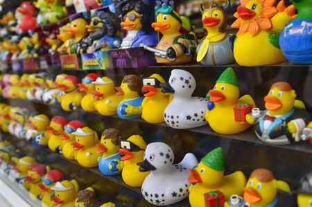 Amsterdam, Holland. August 2019. In the red-light district, a souvenir shop has a showcase filled with small ducks of variegated colors.のeditorial素材