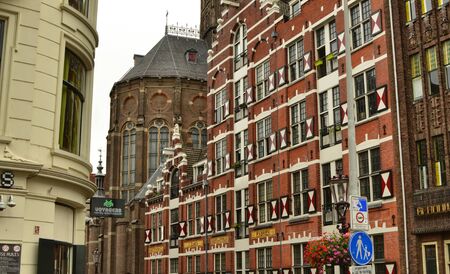 Amsterdam, Holland, August 2019. In the historic center an example of architecture based on red...