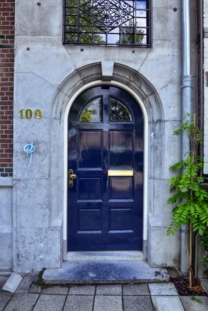 Amsterdam, Holland, August 2019. Along the river Amstel, on the outskirts of the city it is easy to meet house doors with a strong appeal to the London style.のeditorial素材