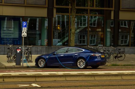 Amsterdam, the Netherlands, August 2019. An electric car from the manufacturer Tesla. It was parked...