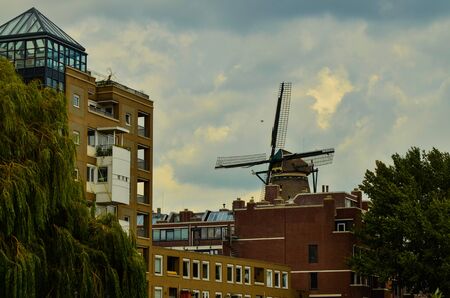 Amsterdam, Holland, August 2019.The De Gooyer Mill is located on the edge of the historic center:it is used as a brewery.Perfectly intact it is a dip in the past in the city.Blue sky with white cloudsのeditorial素材