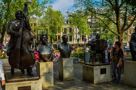 Amsterdam, Holland, August 2019. Five statues of famous singers and musicians on the Elandsgracht.のeditorial素材