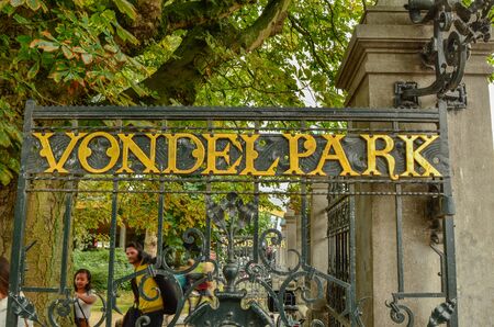 Amsterdam, Holland, August 2019. The Vondelpark gate: the large park in the heart of the city. The golden writing characterizes it.のeditorial素材
