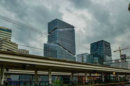 Amsterdam, Holland, August 2019. On the outskirts, along the metro route, it is easy to see modern skyscrapers.のeditorial素材