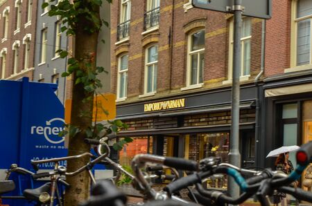 Amsterdam, Holland, August 2019. A rainy day in the shopping street: here are the shops with the most famous luxury fashion brands.のeditorial素材