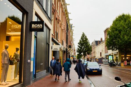 Amsterdam, Holland, August 2019. A rainy day in the shopping street: here are the shops with the...