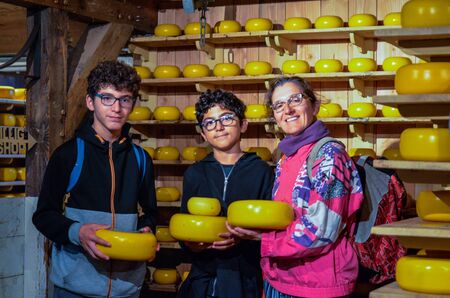 Zaanse Schans, Holland, August 2019. Northeast Amsterdam is a small community located on the Zaan River. In the shop of typical Dutch cheeses you can take a souvenir photo.のeditorial素材