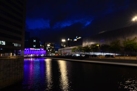 Amsterdam, Netherlands, August 2019. Night view of the modern suburbs. Modern buildings face the canals.のeditorial素材