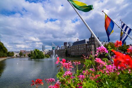 Holland, Den Haag. August 2019. The Hague in English, the Binnenhof is the center of Dutch political life. The buildings overlook the artificial lake with fountains and swans.のeditorial素材