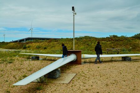 Oosterscheldekering, the netherlands, August 2019. In the Zeeland countryside, wind farms: a particular landscape characterized by wind turbines. A grounded propeller for taking souvenir photos.のeditorial素材