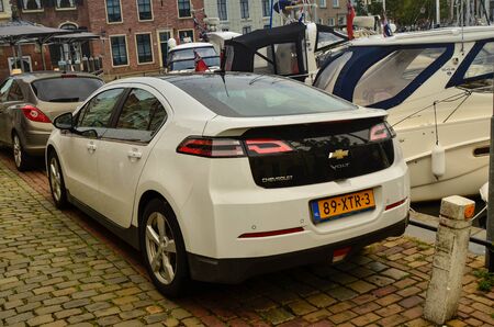 Goes, the Netherlands, August 2019. A chevrolet volt parked along the docks of the harbor. In Holland, attention to environmental impact is directed towards the purchase of eco-friendly car models.のeditorial素材