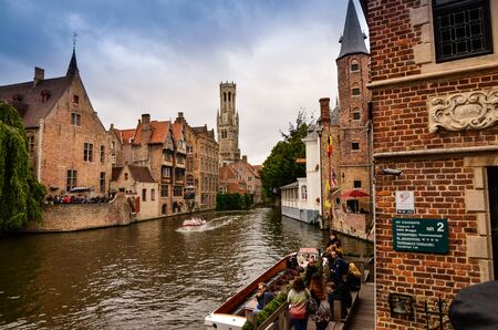 Bruges, flanders belgium.August 2019.Rozenhoedkaai is a landmark of the historic center, the most loved by tourists: the canal that curves around the house with the willow and the bell tower.のeditorial素材