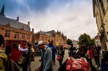 Bruges, flanders belgium. August 2019. Approaching the historic center, the medieval aspect emerges: cobbled streets, low red brick houses.のeditorial素材