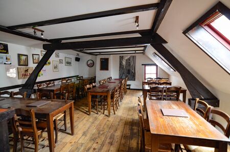 Bruges, flanders, Belgium. August 2019. Interior of the historic de garre brewery. The wooden beams,...