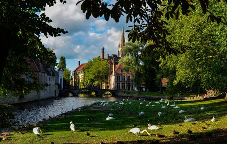 Bruges, Belgium. August 2019. Enchanting postcard view from the vineyard square towards the historic...
