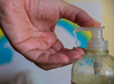 How to kill viruses and bacteria. Close up shot on bottle spout with selective focus. Caucasian...