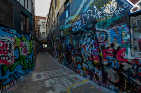 Ghent,Belgium,August 2019. The graffiti street is a narrow street entirely dedicated to street art. In such a clean, elegant and orderly city, we find this type of art concentrated here. Some touristsのeditorial素材