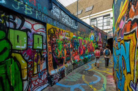 Ghent,Belgium,August 2019. The graffiti street is a narrow street entirely dedicated to street art. In such a clean, elegant and orderly city, we find this type of art concentrated here. Some touristsのeditorial素材