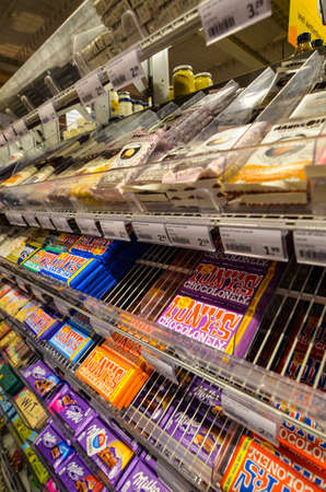 Ghent, Belgium, August 2019. Whole exhibitors dedicated to the Belgian specialty: chocolate at a supermarket. The packaging impresses with bright colors.のeditorial素材