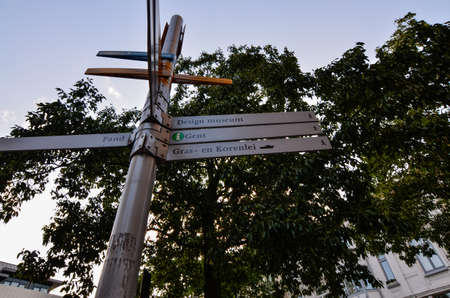Ghent, Belgium, August 2019. In the heart of the historic center a sign with tourist information,...
