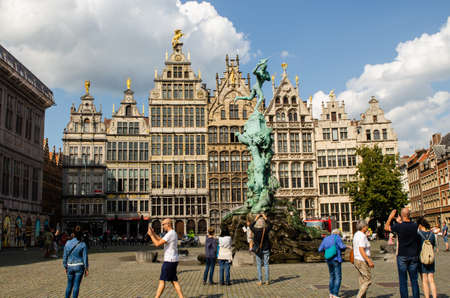 Antwerp,Flanders,Belgium. August 2019. The town hall square, overlook the most beautiful buildings in the city. People walk and stop at the many bars and restaurants. Sunny day, blue sky, white cloudsのeditorial素材