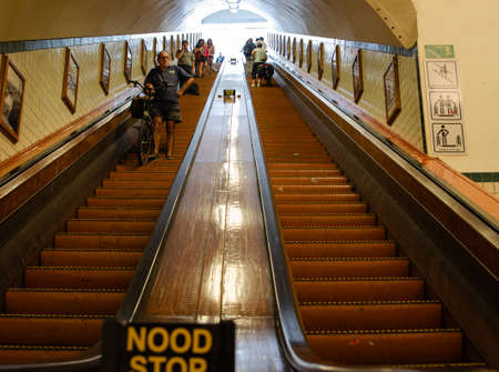 Antwerp, Flanders, Belgium. August 2019. The wooden escalators that lead pedestrians and cyclists to the long underground tunnel, called annatunnel, which passes under the scheldt river.のeditorial素材