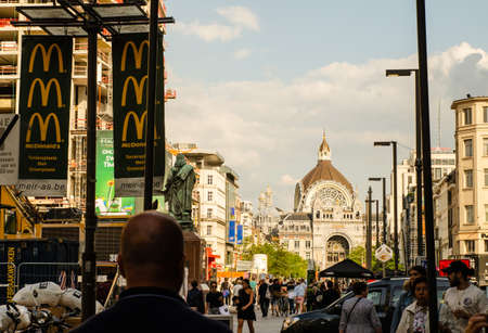 Antwerp, Flanders, Belgium. August 2019. Old town: in the background the imposing railway station. The course leading to it is crowded with people who move chaotically.のeditorial素材