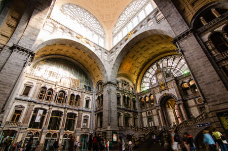 Antwerp, Flanders, Belgium. August 2019. The historic entrance hall of the central railway station is so large and finely decorated that it earns the title of cathedral of the stations. People.のeditorial素材