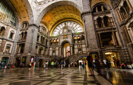 Antwerp, Flanders, Belgium. August 2019. The historic entrance hall of the central railway station is so large and finely decorated that it earns the title of cathedral of the stations. People.のeditorial素材