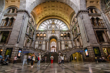 Antwerp, Flanders, Belgium. August 2019. The historic entrance hall of the central railway station is so large and finely decorated that it earns the title of cathedral of the stations. People.のeditorial素材