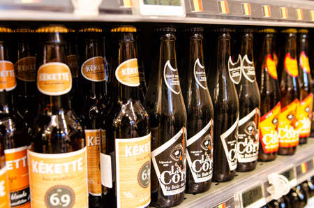 Brussels, Belgium, August 2019. Supermarket shelf with bottles of beer, a Belgian specialty...