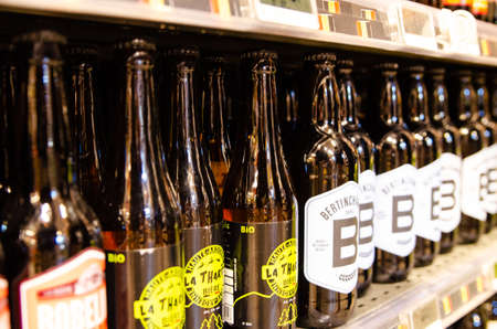 Brussels, Belgium, August 2019. Supermarket shelf with bottles of beer, a Belgian specialty...