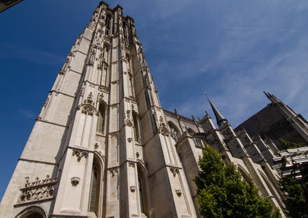 August 2019. The imposing cathedral features a 97-meter bell tower in Gothic style. Beautiful summer day with blue sky.のeditorial素材